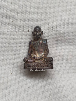 รูปหล่อหลวงปู่คำพันธ์ โฆสปัญโญ รุ่นอุดมมงคล เนื้อเงิน ปี ๒๕๓๖